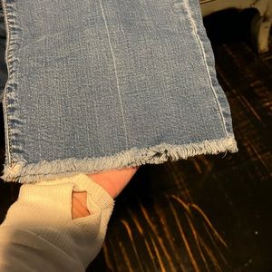 Woman’s flare ankle length Old Navy jeans.